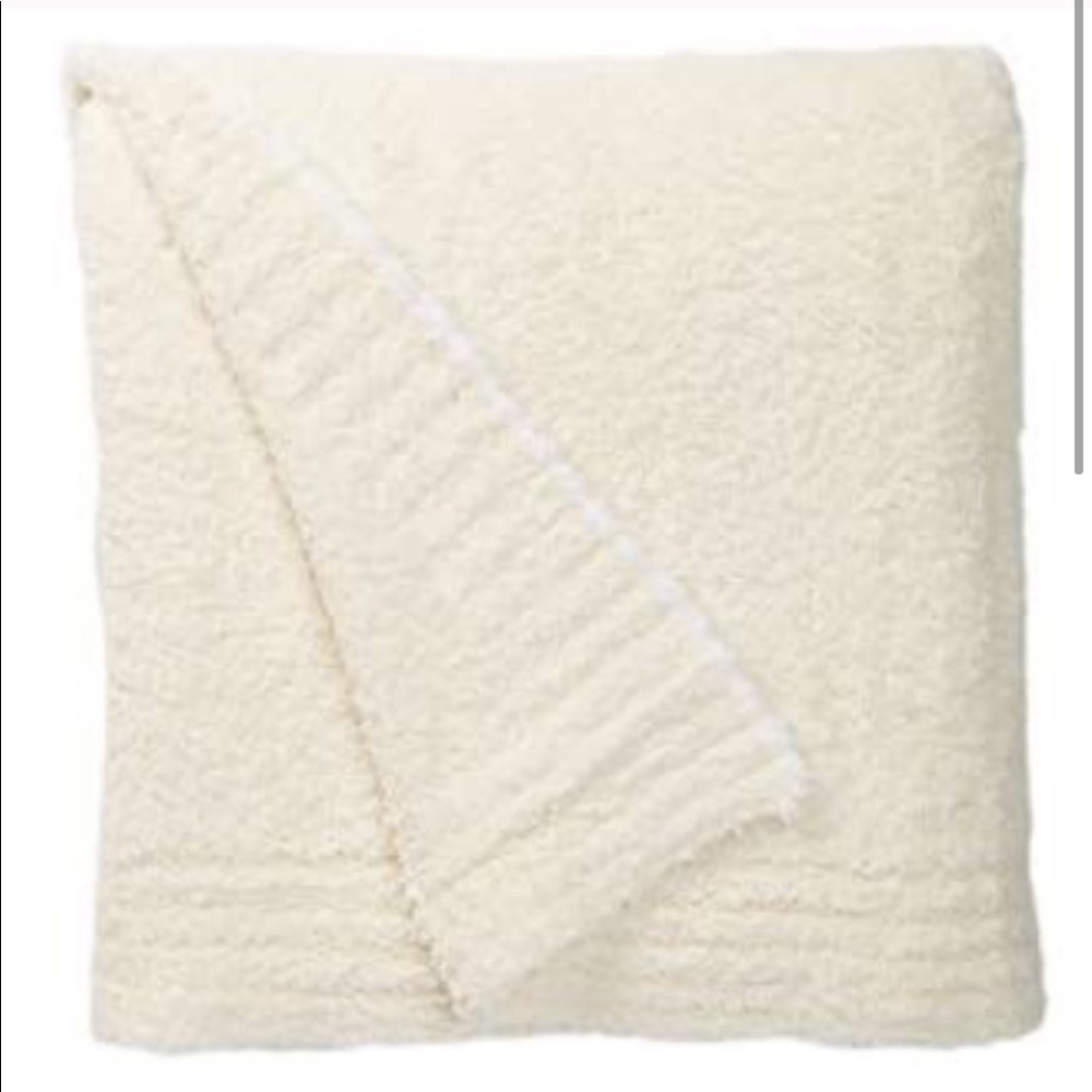 Barefoot dreams throw cream colored